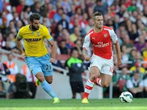 Images Dated 16th August 2014: Jack Wilshere's Magic: Outsmarting Joe Ledley in Arsenal's Premier League Win (August 2014)