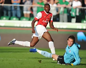 Legia Warsaw V Arsenal 2010-11 Prints: Jay Emmanuel Thomas shoots past Legia goalkeeper Kostyantyn Makhnovskyy to score the 5th Arsenal goal