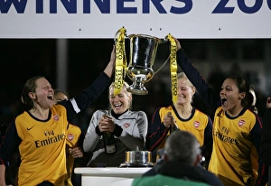 Jayne Ludlow and Alex Scott (Arsenal) lift the League Cup Trophy