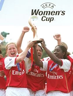 Jayne Ludlow and Anita Asante (Arsenal) lift the European Trophy
