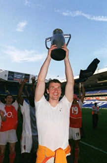 Jens Lehamann (Arsenal) celebrates winning the League