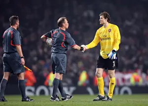 Jens Lehmann (Arsenal) shakes hands with referee Claus Larsen after the match