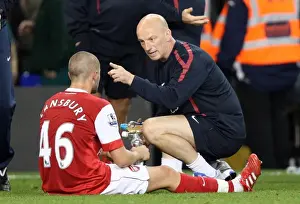 JK talks to Henri Lansbury (Arsenal) during the break before extra time