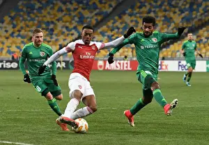 FC Vorskla Poltava V Arsenal 2018-19 Prints: Joe Willock vs Artur: Clash in the Europa League between Arsenal and Vorskla Poltava