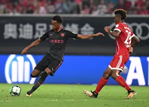 Bayern Munich V Arsenal 2017-18 Prints: Joe Willock vs. Kingsley Coman: Battle in Shanghai - Bayern Munich vs