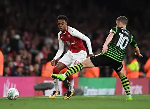 Arsenal V Doncaster Rovers - Carabao Cup 2017-18 Prints: Joe Willock vs. Tommy Rowe: Intense Battle in Arsenal's Carabao Cup Clash Against Doncaster