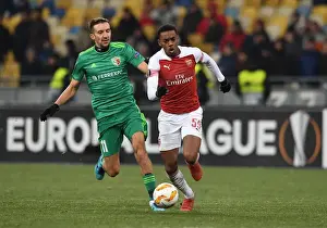 FC Vorskla Poltava V Arsenal 2018-19 Prints: Joe Willock vs. Vyacheslav Sharpar: Arsenal Star Clashes with Vorskla Player in Europa League Match