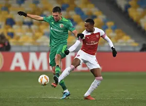 FC Vorskla Poltava V Arsenal 2018-19 Prints: Joe Willock vs Vyacheslav Sharpar: A Battle for Europa League Supremacy