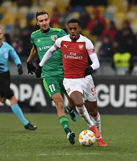 FC Vorskla Poltava V Arsenal 2018-19 Prints: Joe Willock vs. Vyacheslav Sharpar: Clash in the Europa League between Arsenal and Vorskla Poltava