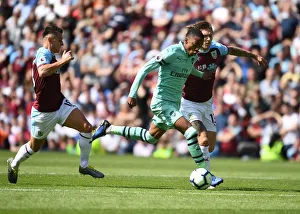 Burnley V Arsenal 2018-19 Prints: Joe Willock's Thrilling Run: Arsenal's Midfielder Surges Past Burnley's Defense in Premier League Clash