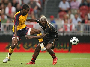 Images Dated 9th August 2008: Johan Djourou (Arsenal) Arouna Kone (Seville)