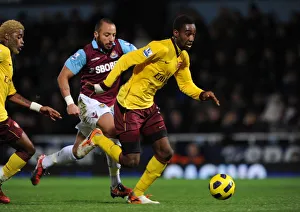 West Ham United v Arsenal 2010-11 Collection: Johan Djourou (Arsenal) Julien Faubert (West Ham). West Ham United 0: 3 Arsenal