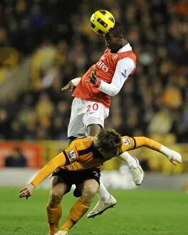 Images Dated 10th November 2010: Johan Djourou (Arsenal) Kevin Doyle (Wolves). Wolverhampton Wanderers 0: 2 Arsenal