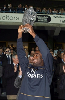 Huddersfield v Arsenal 2008-09 Collection: Johan Djourou (Arsenal) lifts the Chapman trophy