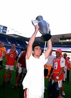 Jose Reyes (Arsenal) celebrates winning the League with an inflatable trophy