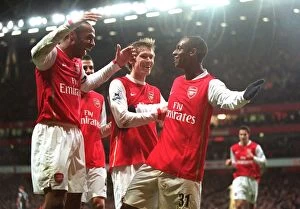 Hoyte Justin Collection: Justin Hoyte celebrates scoring Arsenals 2nd goal with Thierry Henry and Alex Hleb
