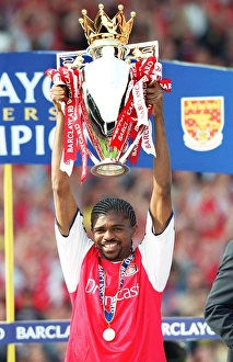 Kanu lifts the F. A. Barclaycard Premiership Trophy