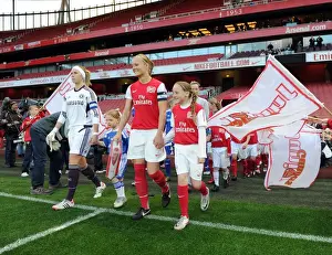 Katie Chapman (Arsenal Ladies) and Carly Telford (Chelsea) lead out their teams