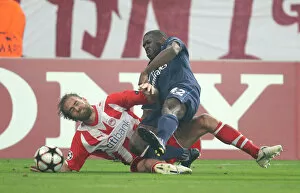 Images Dated 9th December 2009: Kerrea Gilbert (Arsenal) Olof Mellberg (Olympiacos). Olympiacos 1: 0 Arsenal