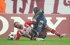 Olympiacos V Arsenal 2009-10 Prints: Kerrea Gilbert (Arsenal) Olof Mellberg (Olympiacos). Olympiacos 1: 0 Arsenal