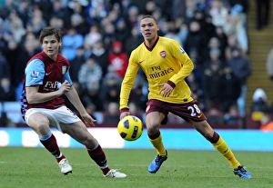 Aston Villa v Arsenal 2010-11 Gallery: Kieran Gibbs (Arsenal) Chris Herd (Villa). Aston Villa 2: 4 Arsenal. Barclays Premier League