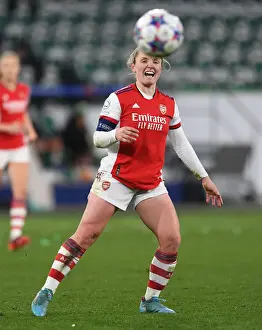 VfL Wolfsburg V Arsenal Women 2021-22 Prints: Kim Little's Determined Battle: Arsenal Women's Champions League Clash Against VfL Wolfsburg