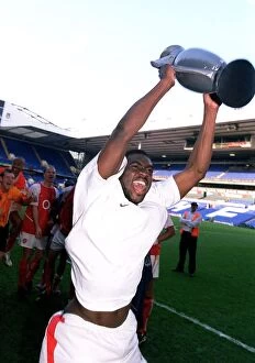 Kolo Toure (Arsenal) celebrates winning the League with an inflatable trophy