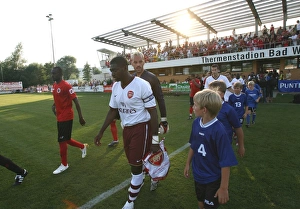 Kolo Toure (Arsenal) leads out the team