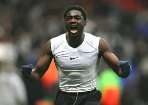 Bolton Wanderers v Arsenal 2007-8 Collection: Kolo Toure celebrates the Arsenal victory after the match