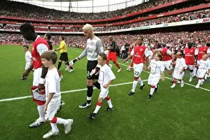 Images Dated 1st August 2007: Kolo Toure and Manuel Almunia (Arsenal) lead out the team