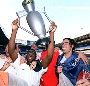 Kolo Toure and Robert Pires (Arsenal) celebrate winning the League