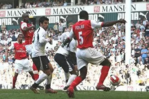Kolo Toure shoots past Tottenham goalkeeper PAul Robinson to score the 1st Arsenal goal