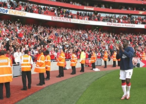 Toure Kolo Prints: Kolo Toure waves to the Arsenal fans after the match