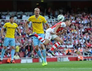 Images Dated 16th August 2014: Koscielny Scores Under Pressure: Arsenal vs. Crystal Palace, Premier League 2014