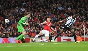 Images Dated 28th April 2014: Koscielny Stuns Newcastle: The Thrilling Moment Arsenal's Defender Scores Past Krul and Sissoko