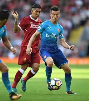 Liverpool V Arsenal 2017-18 Prints: Koscielny vs. Firmino: Battle at Anfield - Liverpool vs. Arsenal, Premier League 2017-18