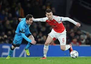 Arsenal v Barcelona 2015/16 Collection: Koscielny vs. Messi: Arsenal's Defensive Battle in Champions League Clash