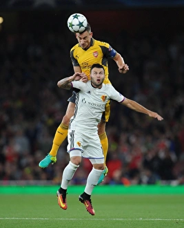 Arsenal V FC Basel 2016-17 Prints: Koscielny's Defiant Header: Arsenal vs. Basel in Champions League Showdown