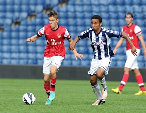 West Bromwich Albion U21 v Arsenal U21 2012-13 Collection: Kris Olsson (Arsenal) Mani O Sullivan (WBA). West Bromwich Albion U21 1: 0 Arsenal U21