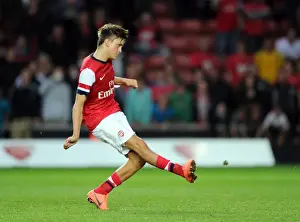Kristoffer Olsson scores for Arsenal from the penalty spot during the shoot out