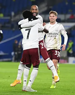 Brighton And Hove Albion V Arsenal 2020-21 Prints: Lacazette and Saka Celebrate Arsenal's Goal Against Brighton & Hove Albion (2020-21)