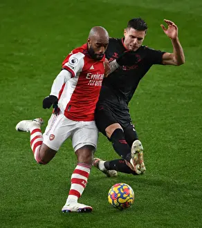 Arsenal V Southampton 2021-22 Prints: Lacazette vs Bednarek: A Football Battle in the Arsenal vs Southampton Premier League Clash (2021-22)