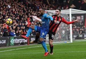 Images Dated 14th January 2018: Lacazette vs Cook: Intense Battle in AFC Bournemouth vs Arsenal Premier League Clash