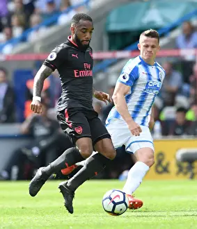 Lacazette vs. Hogg: Intense Battle in Huddersfield Town vs. Arsenal Premier League Clash