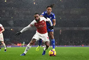 Arsenal V Cardiff City 2018-19 Prints: Lacazette vs. Reid: A Premier League Battle at Arsenal's Emirates Stadium