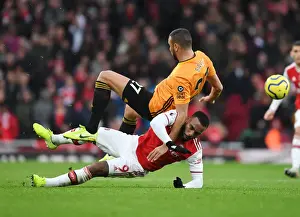 Lacazette vs. Saiss: A Premier League Battle at the Emirates