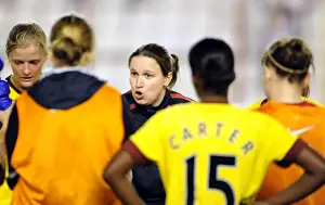 Laura Harvey the Arsenal Ladies Manager holds post match debreif on the pitch