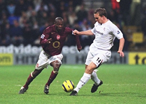 Bolton v Arsenal 2005-6 Collection: Lauren (Arsenal) Kevin Davies (Bolton). Bolton Wanderers 2: 0 Arsenal