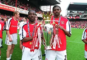 Lauren and Kanu lift the F. A. Barclaycard Premiership Trophy