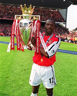 Lauren lifts the F. A. Barclaycard Premiership Trophy